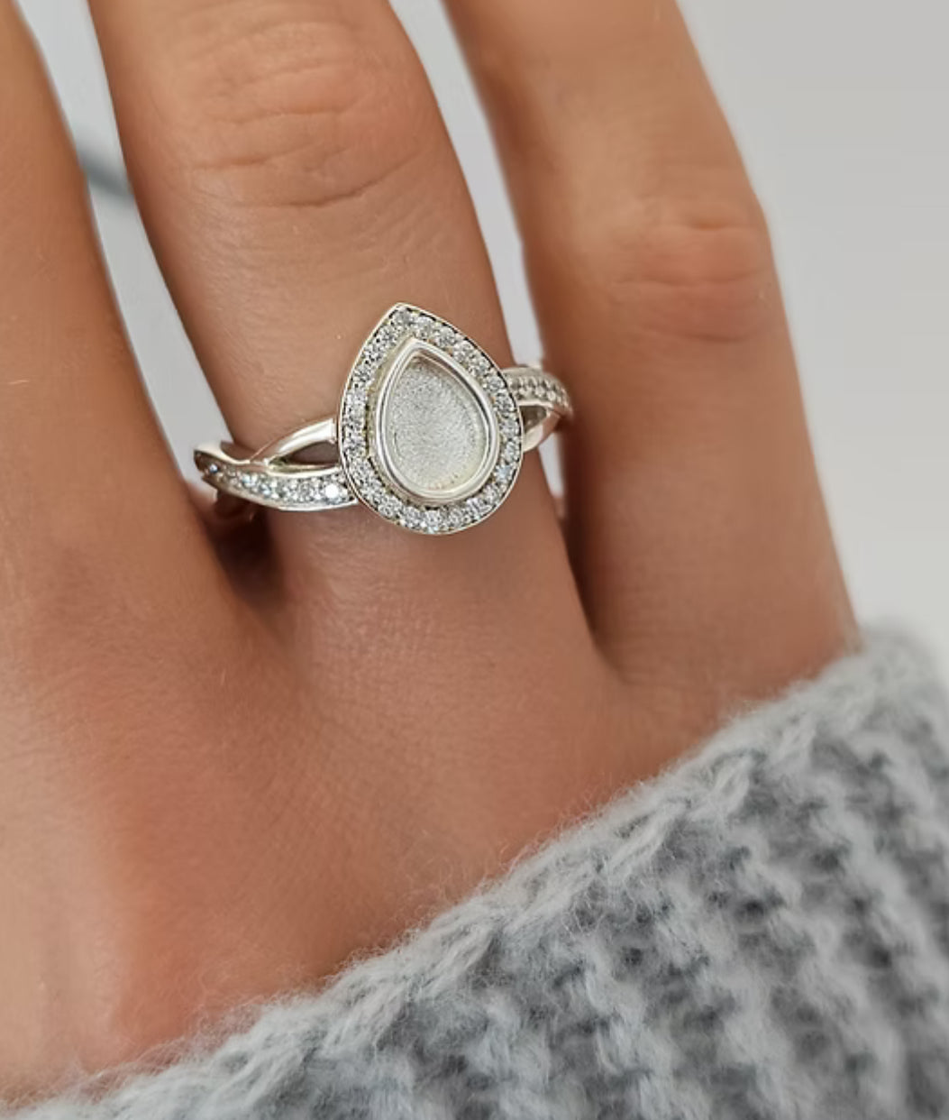 Criss cross pear ring