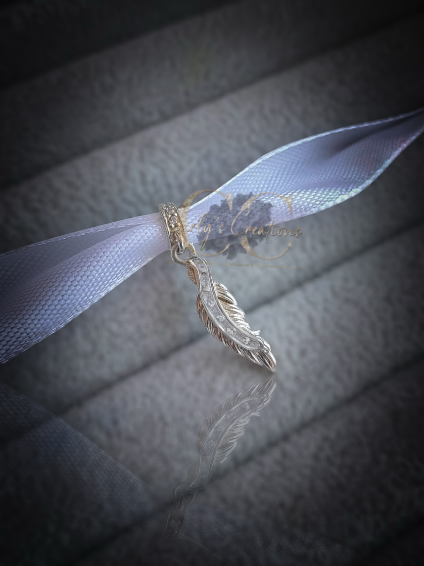 Feather charm